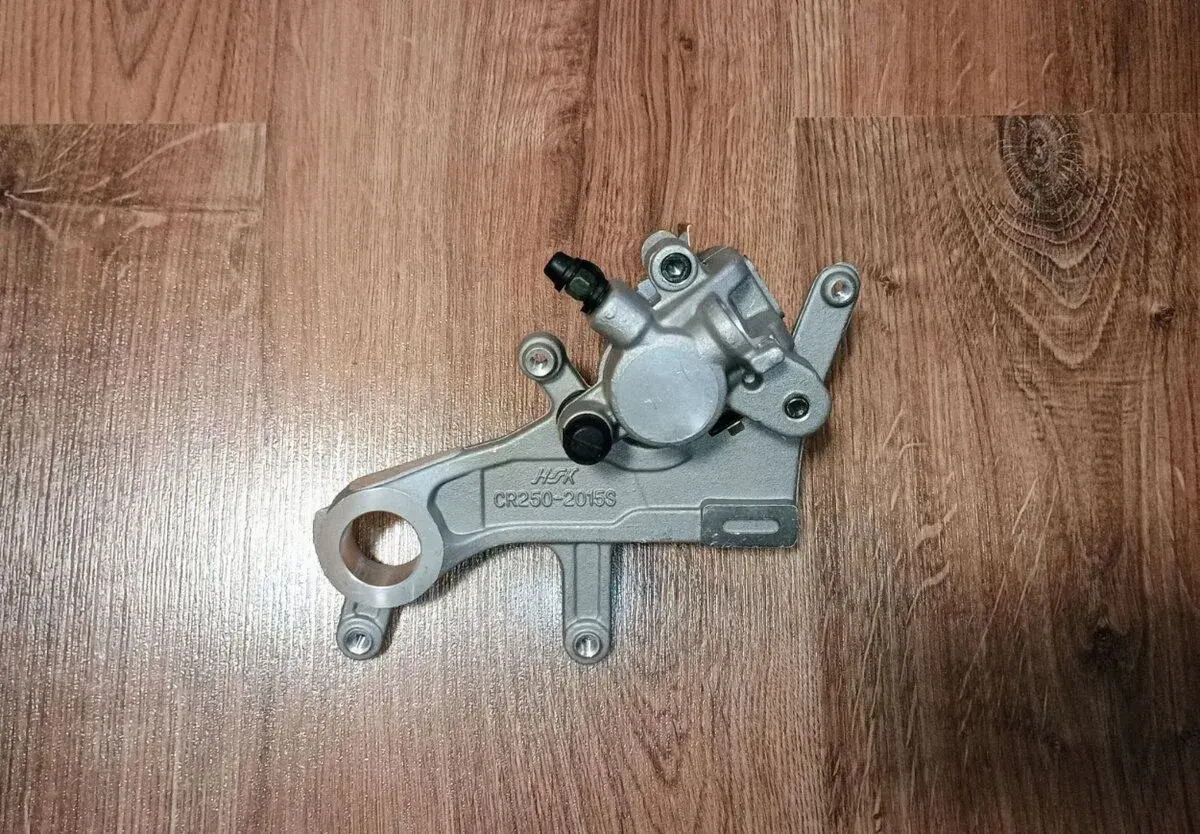 Brzdový strmeň zadný Honda CR/CRF