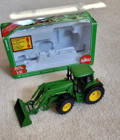 Siku traktor John Deere s nakladacom 1:32